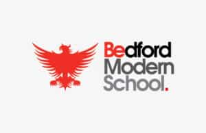 Logo for Bedford Modern School featuring a bold red stylised eagle on the left, and the school name in black, red, and grey text on the right: Bedford Modern School.